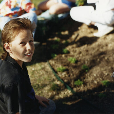 Boy Planting Flowers at the Broomfield Depot Museum