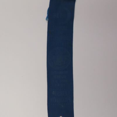 Back of ribbon: Origsize: 1.5" (w) x 8" (l); Origformat: Artifact