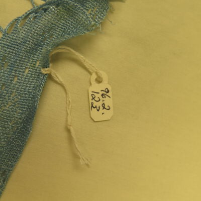 Close up of number on shawl.: Origsize: 14" (w) x 50" (l); Origformat: Artifact