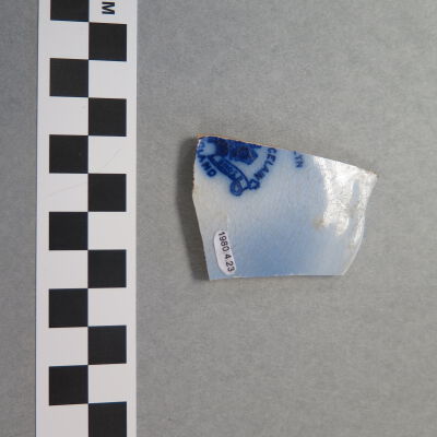 Back of saucer fragment.: Origsize: 1.5" (w) x 2.25" (l); Origformat: Artifact