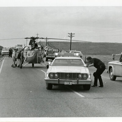 Patrol car and police officer at a car accident site, Highway 287