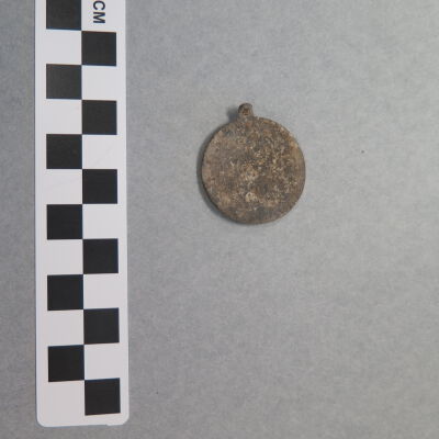 Front of tag.: Origsize: 1.5" (diam); Origformat: Artifact