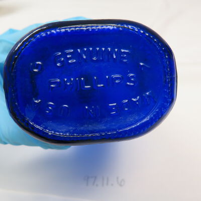 Bottom of bottle.: Origsize: 9" (h) x 3" (w) x 2.; Origformat: Artifact