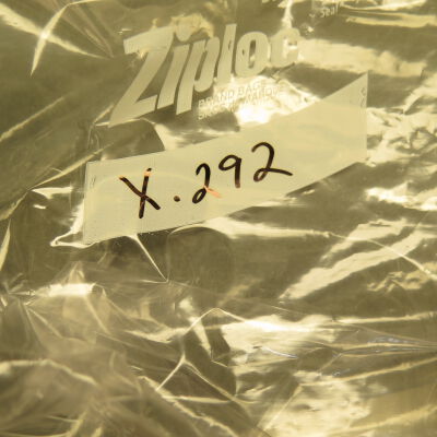Close up of number on bag.: Origsize: 2.5" (w) x 27" (l); Origformat: Artifact