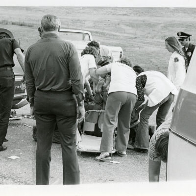 Patient being loaded onto a stretcher from a car accident, Highway 287