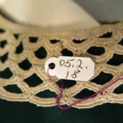 Tag of dress: Origsize: 10.5" (w) x 17" (l); Origformat: Artifact