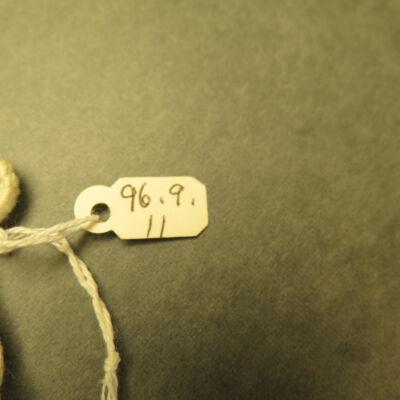 Number on wall hanging.: Origsize: 5" (w) x 10" (l); Origformat: Artifact