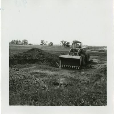 Bulldozer working at relocation site for the Broomfield train depot, 1976: Origsize: 3.5" x 3.5"; Origformat: Print-Photographic; Resolution: 1500dpi