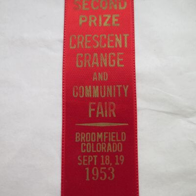 Close up of text on ribbon.: Origsize: 1.5" (w) x 6.75" (l); Origformat: Artifact