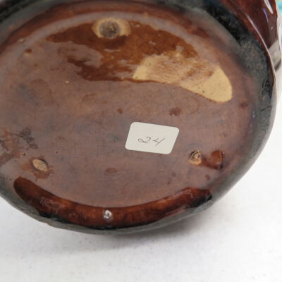 Bottom of flower pot.: Origsize: 7.5" (h) x 8" (dia); Origformat: Artifact
