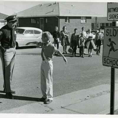 Officer McCarthy with Children near Cottage Schools