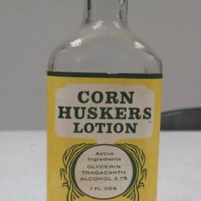 Front of bottle showing label: Origsize: 7" (h) x 2.5" (w); Origformat: Artifact