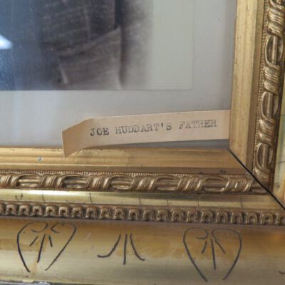 Close up of label on frame.: Origsize: 15.5" (h) x 13.5" (w; Origformat: Artifact