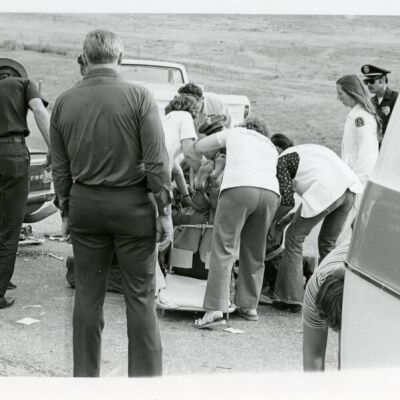 Patient being loaded onto a stretcher from a car accident near Broomfield: Origsize: 5" x 7"; Origformat: Print-Photographic; Resolution: 725dpi