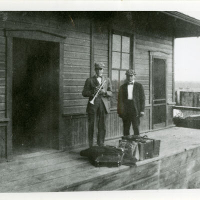 Two Young Men with a Trumpet at the Broomfield Depot