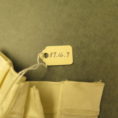Close up of number on gloves.: Origsize: 3" (w) x 6" (l); Origformat: Artifact