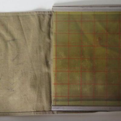 Map grid in bag: Origsize: 17" (h) x 9" (w) x 3; Origformat: Artifact