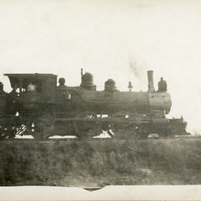 Postcard of Steam Locomotive Traveling