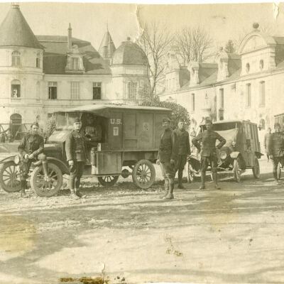 Soldiers Standing in Front of Medical Trucks