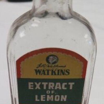 Front of bottle with label showing: Origsize: 6" (h) x 2.5" (w) x; Origformat: Artifact