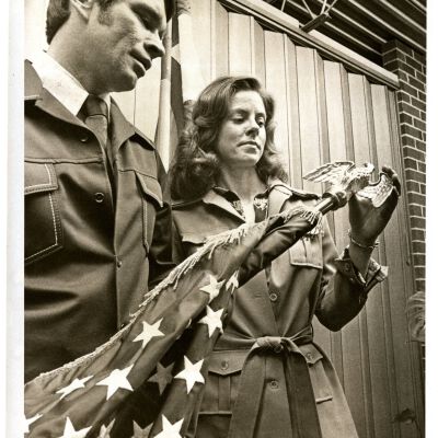 "Bicentennial Presentation" - Man and woman holding flag