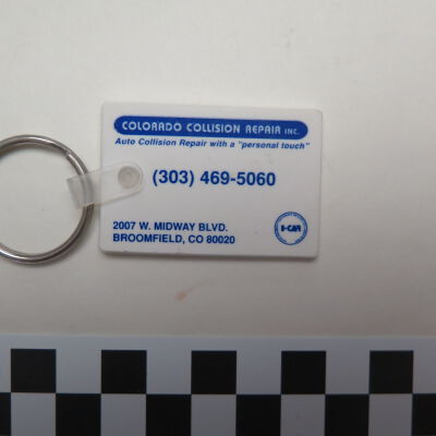 Close up of front of key chain.: Origsize: 3.25" (w) x 1.5" (l); Origformat: Artifact