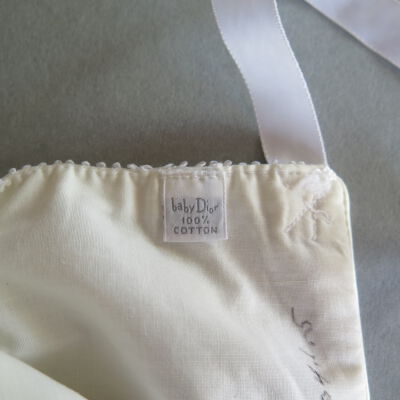 Tag of cap: Origsize: 6" (w) x 7" (l); Origformat: Artifact