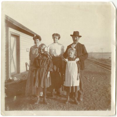 Brown Family Posing by Railroad Tracks
