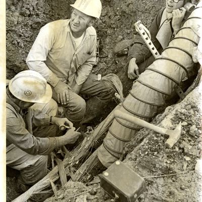 Three telephone line workers - "Damp Phone"