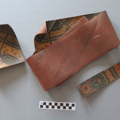 All three linoleum pieces.: Origsize: 2" (w) x 10.25" (l); Origformat: Artifact