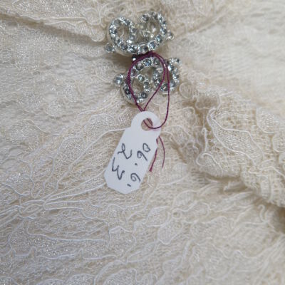 Close up of clasp: Origsize: 12" (w) x 14" (l) x; Origformat: Artifact