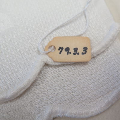 Close up of number on hand towel.: Origsize: 21" (w) x 32" (l); Origformat: Artifact
