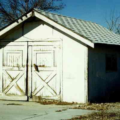 Small two-door white shed on Brunner Property