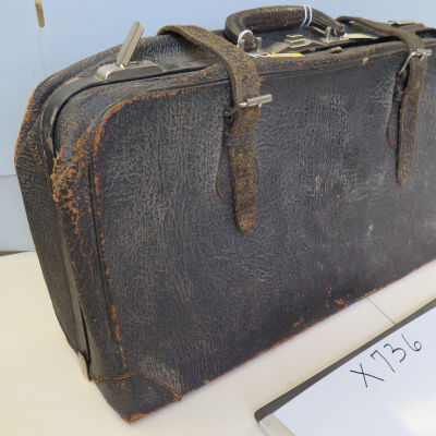 Side of suitcase: Origsize: 14.5" (h) x 25" (w); Origformat: Artifact