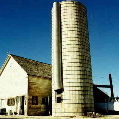Grain silo next to a building on the Brunner property