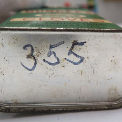 Bottom of tin showing number: Origsize: 3" (h) x 2.25" (w) x; Origformat: Artifact