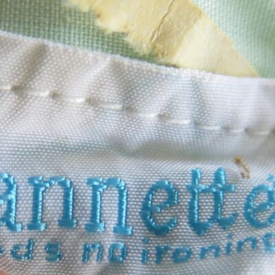 Tag of dress: Origsize: 10" (w) x 13" (l); Origformat: Artifact