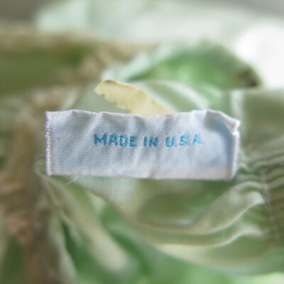 Back of tag: Origsize: 10" (w) x 13" (l); Origformat: Artifact