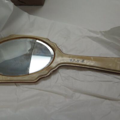 Front of mirror showing crack: Origsize: 5.25" (w) x 12.75" (; Origformat: Artifact