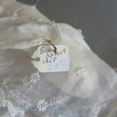 Front of tag: Origsize: 15" (w) x 30" (l); Origformat: Artifact
