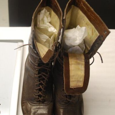Pair of shoes from the front: Origsize: 9.75" (h) x 3"(w) x; Origformat: Artifact