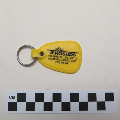 Close up of text on front of key chain.: Origsize: 3" (w) x 1.5" (l); Origformat: Artifact