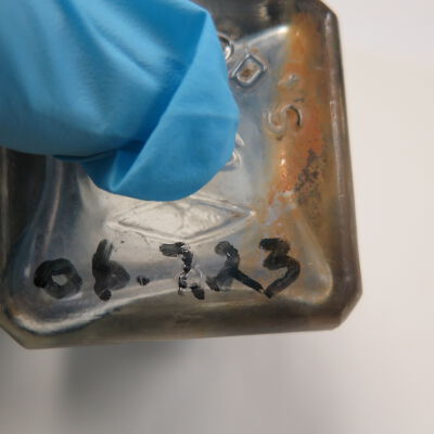 Bottom of ink bottle: Origsize: 2.5" (h) x 2" (w) x; Origformat: Artifact