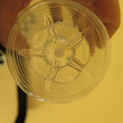 Bottom of water bottle.: Origsize: 8" (h) x 3" (w); Origformat: Artifact