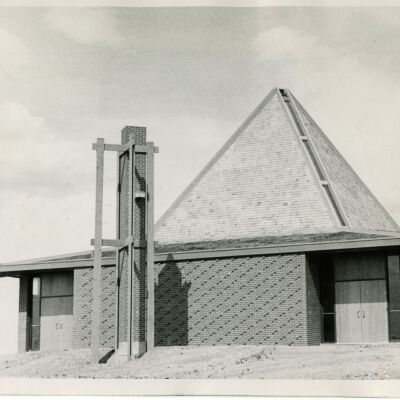 Reverand Joseph Aminnis in Front of Episcopal Chapel