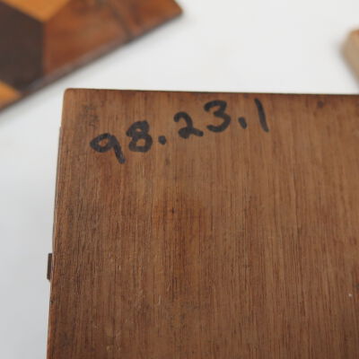 Bottom of jewelry box.: Origsize: 3.5" (h) x 7.5" (w); Origformat: Artifact