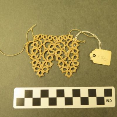 One side of lace.: Origsize: 2" (w) x 2.5" (l); Origformat: Artifact