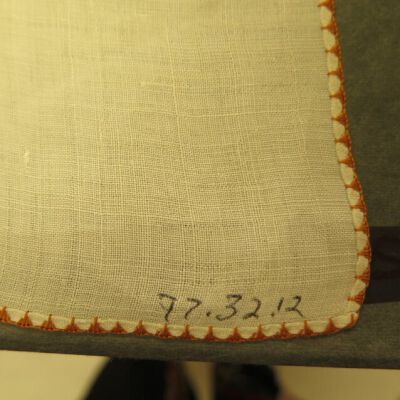 Close up of number on furniture scarf.: Origsize: 18" (w) x 22.5" (l); Origformat: Artifact