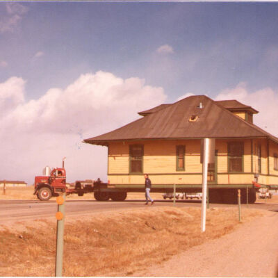 Broomfield Depot on Flatbed Truck Crossing an Intersection