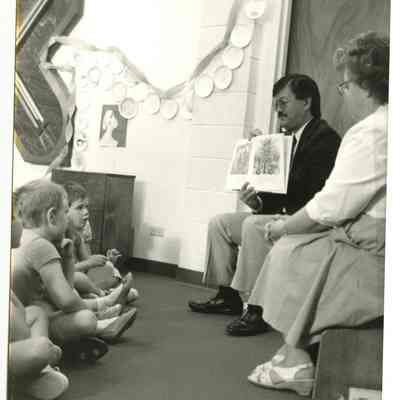 Charles Ozaki and Mary Jane Bailey Reading to Children